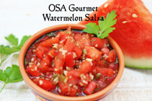 bowl of watermelon salsa with slice of watermelon